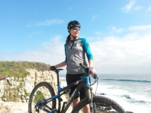 Alicia with mountain bike at beach